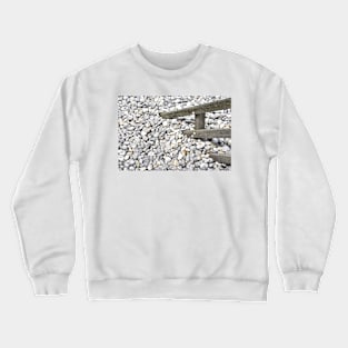 Pebbles covering a fence at  Sheringham, UK Crewneck Sweatshirt